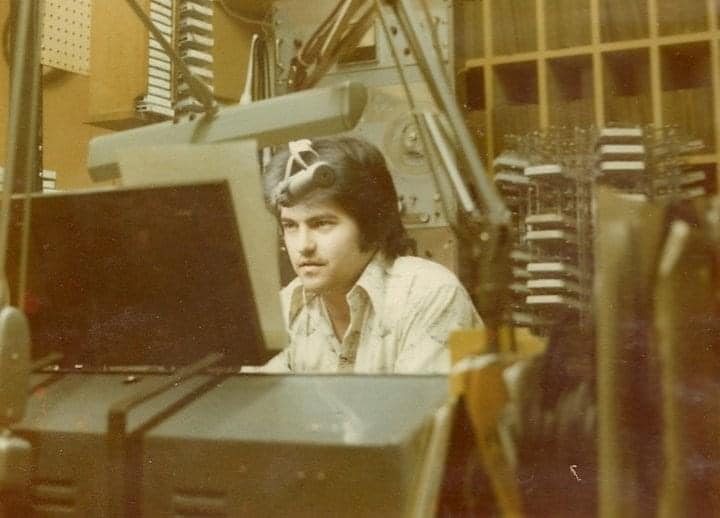Broadcaster seated at a WERH studio console