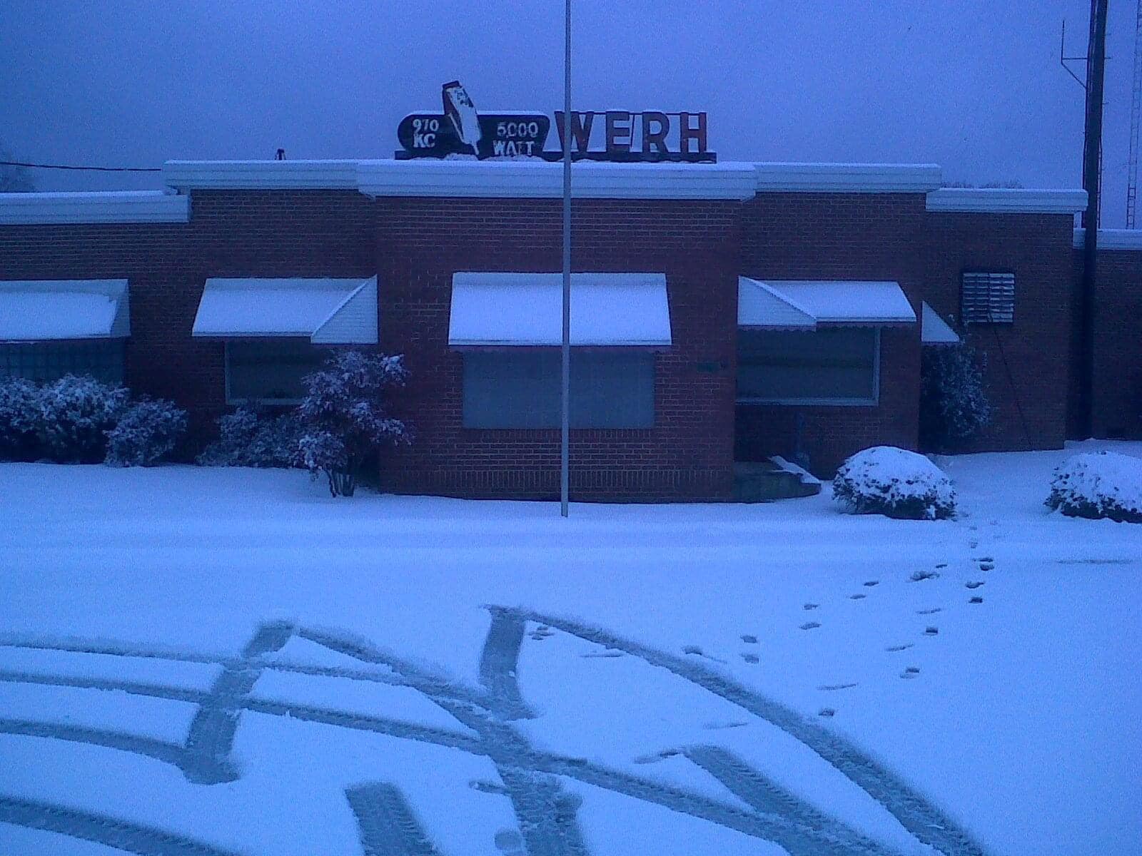 WERH building in winter beneath a rooftop sign
