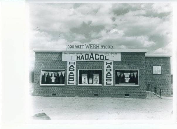 Early WERH building with a HaDaCol advertisement across its windows
