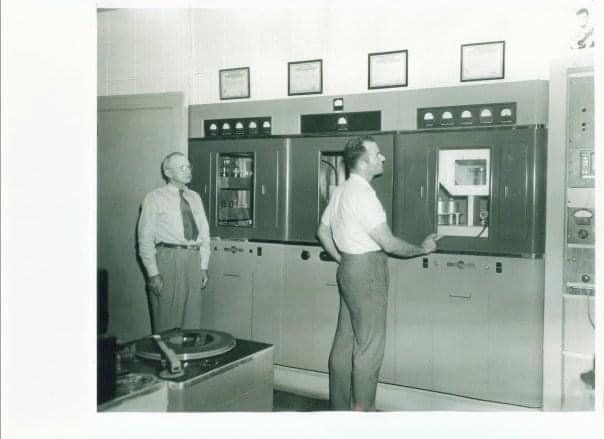 Two men beside broadcast equipment