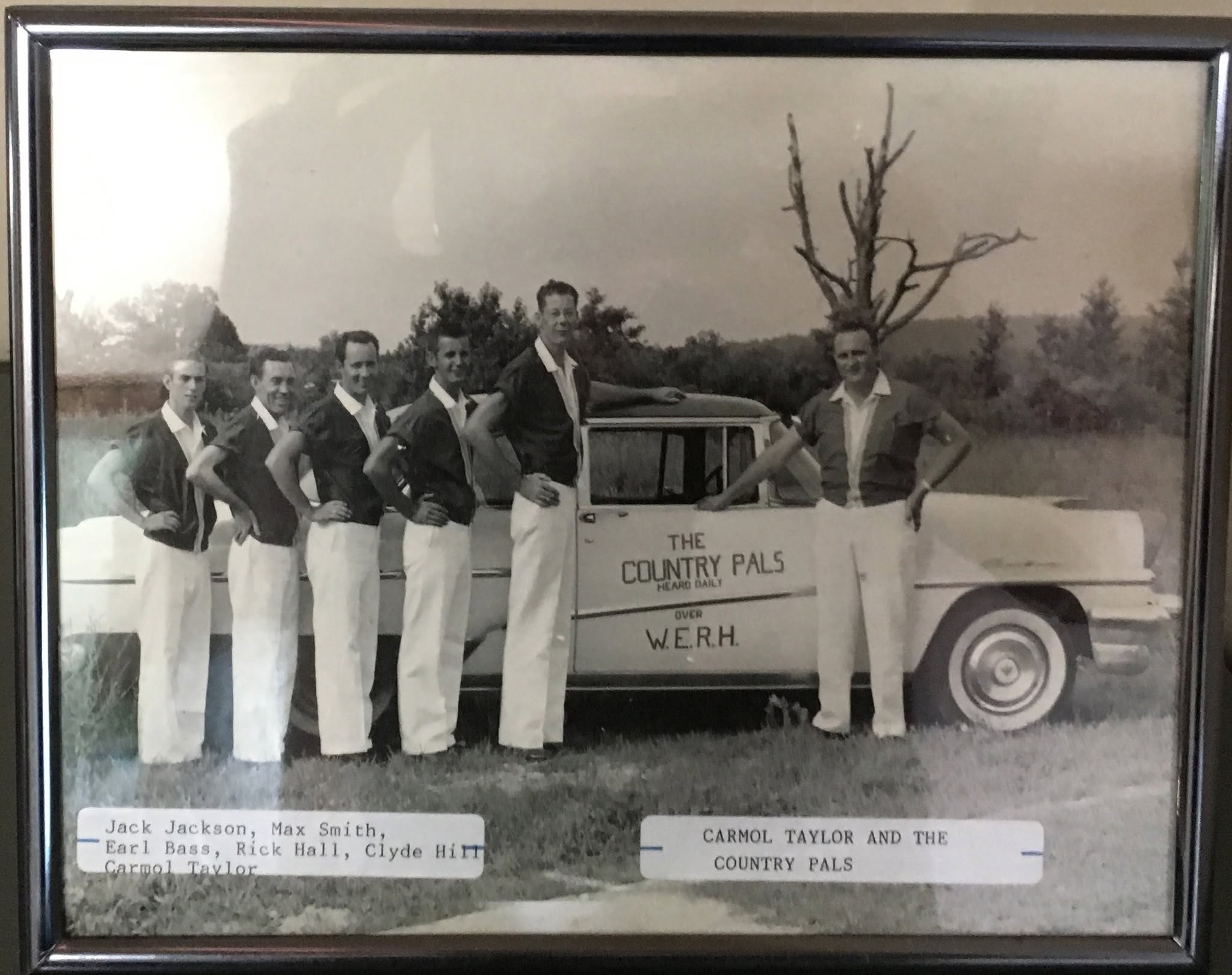 Carmol Taylor and the Country Pals posed beside their WERH pickup truck